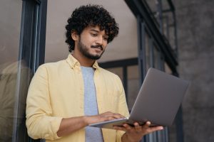 man holding laptop