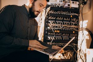 young it man with laptop